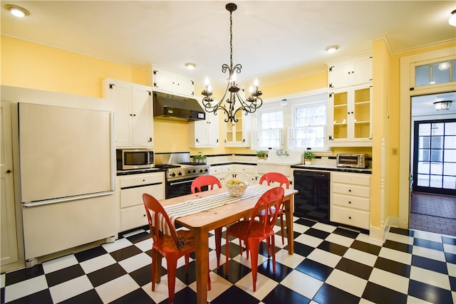 kitchen with white cabinets, appliances with stainless steel finishes, and ornamental molding