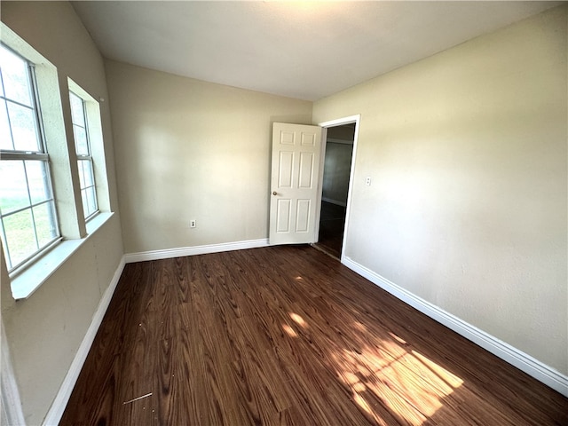 empty room featuring dark hardwood / wood-style floors