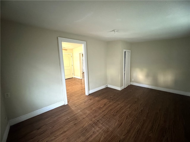 empty room featuring dark wood-type flooring