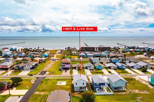 1007 S Live Oak St, Rockport, TX 78382 - aerial perspective of suburban area featuring a large body of water and property parcel outlined