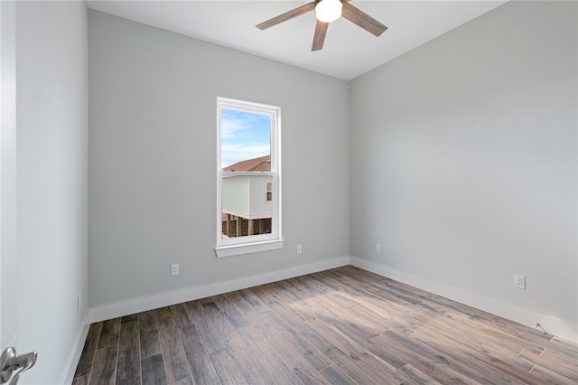 spare room featuring hardwood / wood-style flooring and ceiling fan