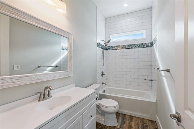 1007 S Live Oak St, Rockport, TX 78382 - bathroom featuring wood finished floors, vanity, toilet, shower / bathtub combination, and recessed lighting