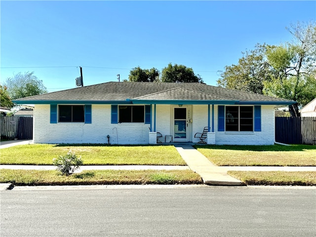 single story home with a front lawn and a porch