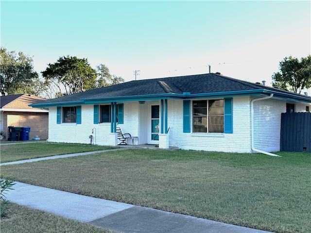 ranch-style home with a front yard