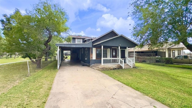 134 W C Ave, Kingsville, TX 78363 - view of front of home featuring an attached carport, a porch, and driveway