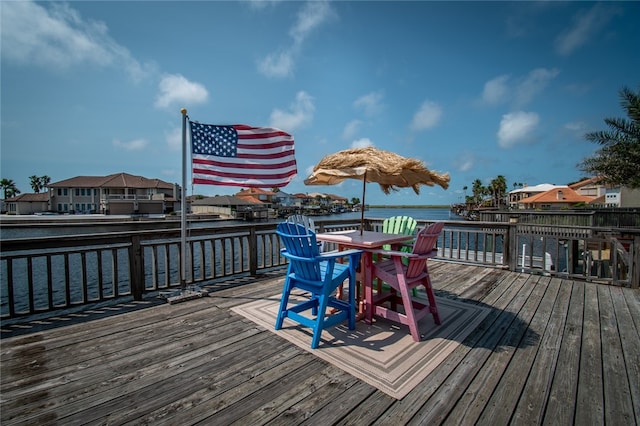 wooden deck featuring a water view