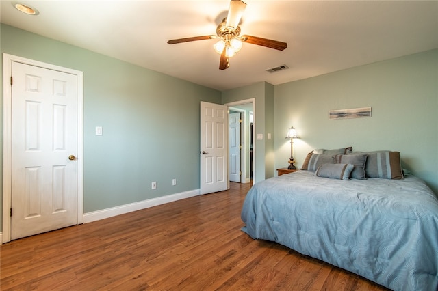 bedroom featuring hardwood / wood-style floors and ceiling fan