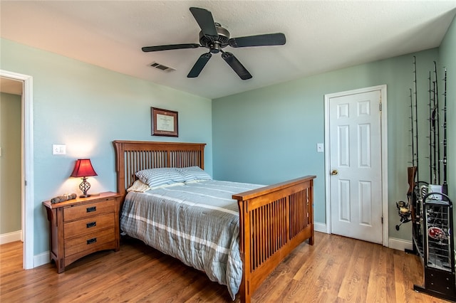 bedroom featuring ceiling fan and light hardwood / wood-style flooring