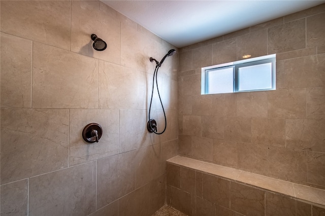 bathroom featuring tiled shower