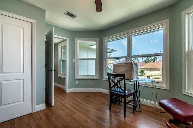 sitting room featuring dark hardwood / wood-style flooring and ceiling fan