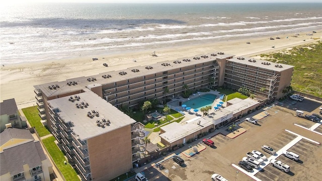 aerial view with a water view and a view of the beach