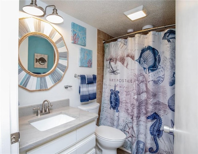 bathroom featuring vanity, curtained shower, toilet, and a textured ceiling