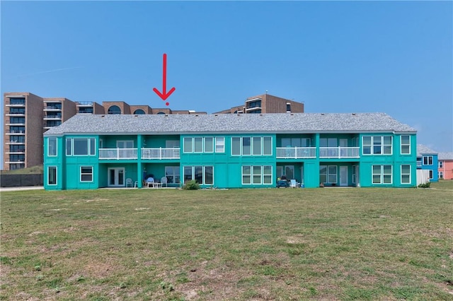 800 Beach Access Road 1a 804, Port Aransas, TX 78373 - rear view of property with a balcony and a yard