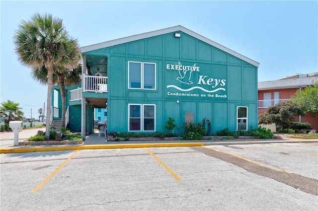 800 Beach Access Road 1a 804, Port Aransas, TX 78373 - view of building exterior featuring uncovered parking and stairs