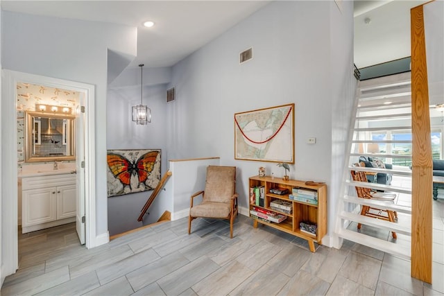 800 Beach Access Road 1a 804, Port Aransas, TX 78373 - sitting room with a chandelier, wood finish floors, a high ceiling, recessed lighting, and baseboards