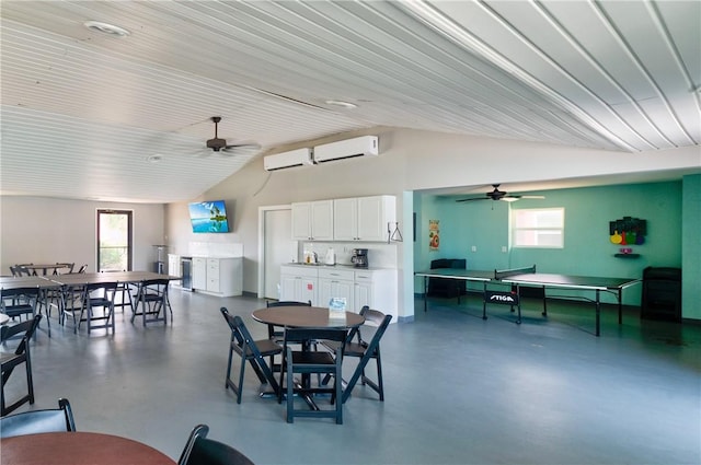 800 Beach Access Road 1a 804, Port Aransas, TX 78373 - dining area featuring an AC wall unit, ceiling fan, finished concrete floors, healthy amount of natural light, and high vaulted ceiling