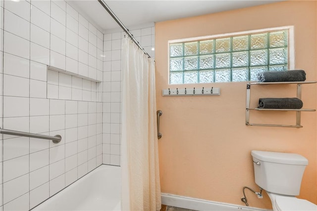 800 Beach Access Road 1a 804, Port Aransas, TX 78373 - full bathroom with toilet, baseboards, and shower / bathtub combination with curtain