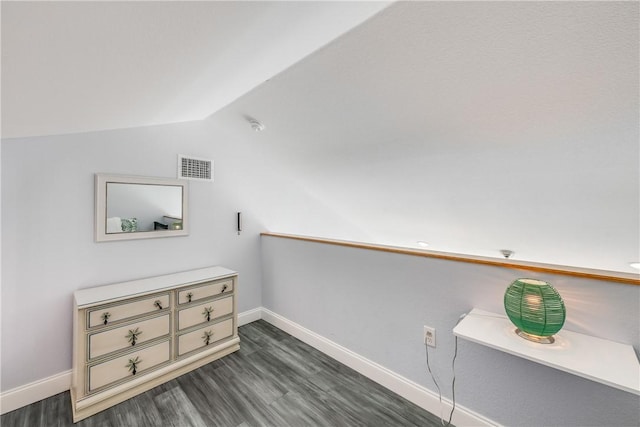 800 Beach Access Road 1a 804, Port Aransas, TX 78373 - bonus room with baseboards, dark wood finished floors, and vaulted ceiling