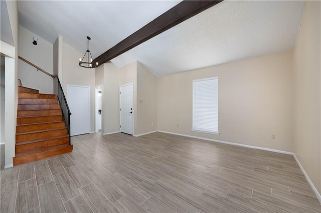 unfurnished living room featuring stairs, wood finish floors, and vaulted ceiling with beams