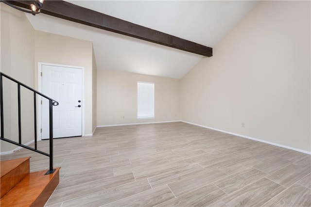 unfurnished living room featuring stairs, wood tiled floor, baseboards, and vaulted ceiling with beams