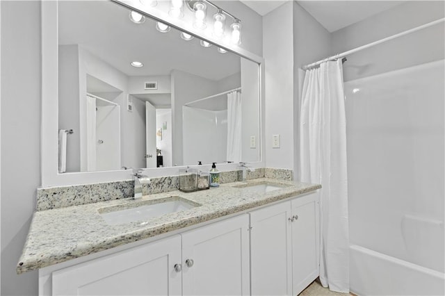 bathroom with vanity and shower / bath combo with shower curtain