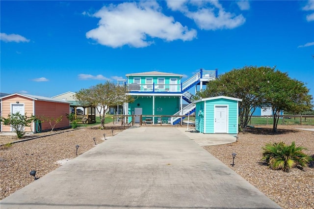2001 S Doughty St, Rockport, TX 78382 - coastal home featuring a storage unit, an outbuilding, and stairway