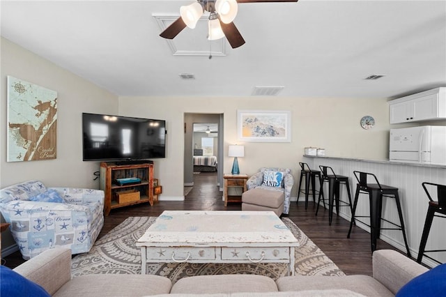 2001 S Doughty St, Rockport, TX 78382 - living room with a ceiling fan, wood finished floors, and baseboards