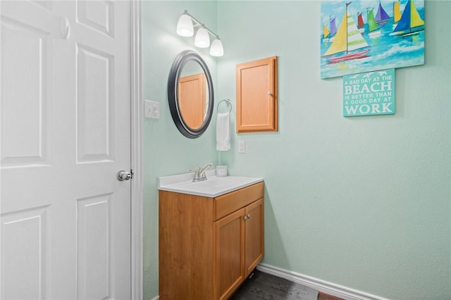 2001 S Doughty St, Rockport, TX 78382 - bathroom with baseboards and vanity