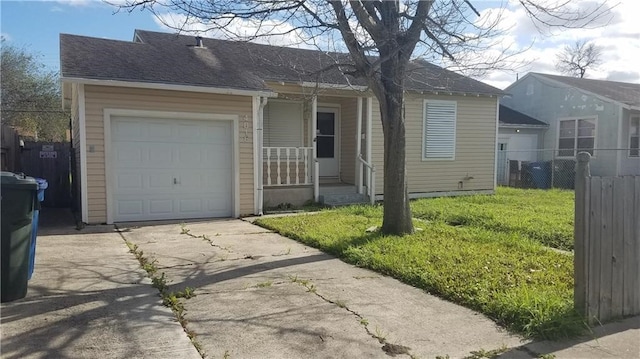 ranch-style house featuring a garage and a front lawn