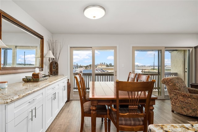 dining area featuring hardwood / wood-style floors and a wealth of natural light