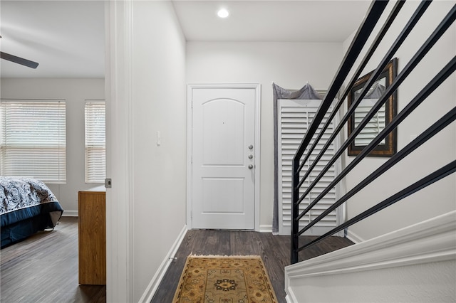 entryway featuring dark hardwood / wood-style flooring and ceiling fan