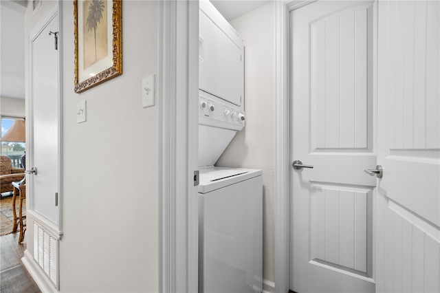 washroom with stacked washer and dryer