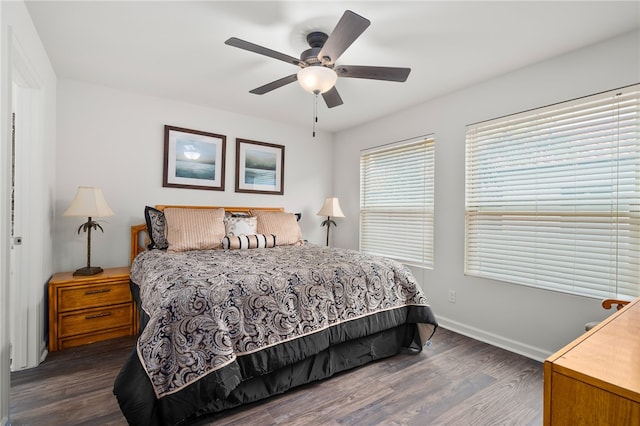 bedroom featuring ceiling fan and dark hardwood / wood-style floors