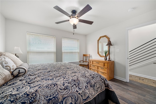 bedroom featuring dark hardwood / wood-style flooring and ceiling fan