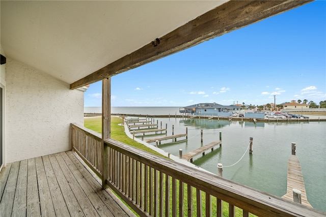 balcony featuring a water view and a boat dock