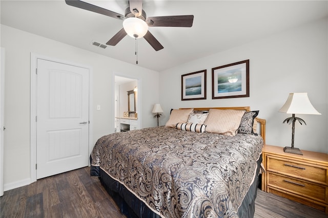 bedroom featuring ensuite bath, ceiling fan, and dark hardwood / wood-style floors