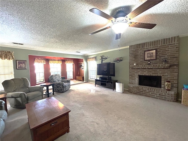 carpeted living room featuring ceiling fan, ornamental molding, a textured ceiling, and a brick fireplace