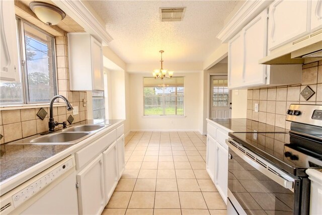 2721 Tumbleweed Dr, Corpus Christi, TX 78410 - kitchen featuring stainless steel range with electric cooktop, white dishwasher, a chandelier, a textured ceiling, and backsplash
