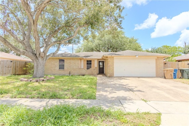 2721 Tumbleweed Dr, Corpus Christi, TX 78410 - ranch-style home featuring a garage, concrete driveway, and brick siding