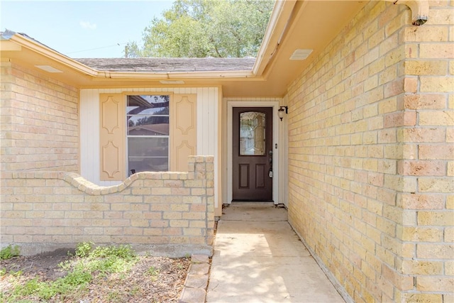 2721 Tumbleweed Dr, Corpus Christi, TX 78410 - view of exterior entry with brick siding and a shingled roof