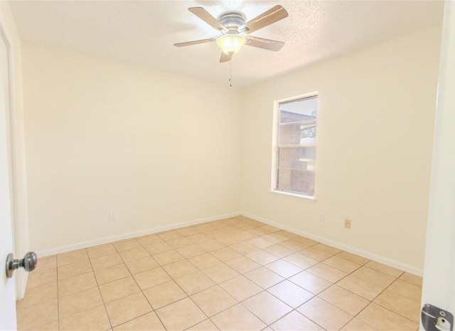 2721 Tumbleweed Dr, Corpus Christi, TX 78410 - spare room with ceiling fan, light tile patterned floors, and a textured ceiling