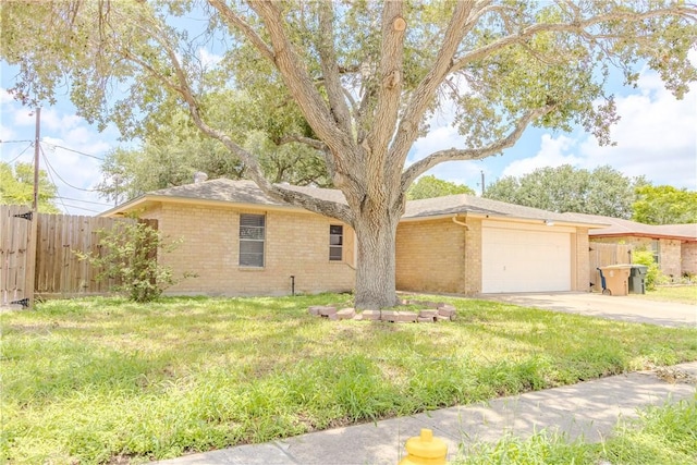 2721 Tumbleweed Dr, Corpus Christi, TX 78410 - ranch-style home featuring brick siding, concrete driveway, and an attached garage