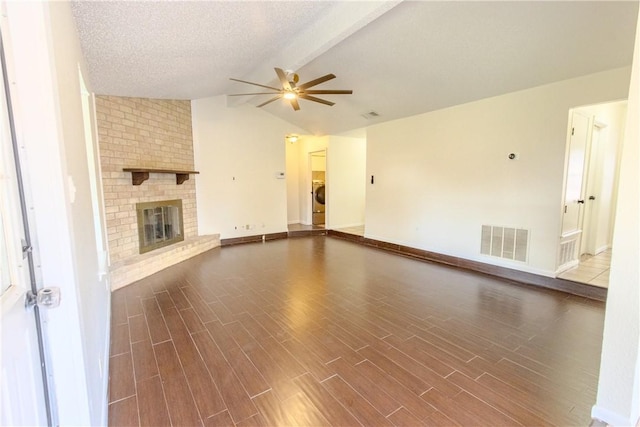 2721 Tumbleweed Dr, Corpus Christi, TX 78410 - unfurnished living room with a ceiling fan, a fireplace, dark wood-style floors, and washer / clothes dryer