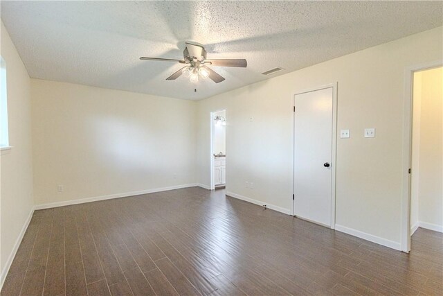 2721 Tumbleweed Dr, Corpus Christi, TX 78410 - unfurnished room featuring ceiling fan, dark wood finished floors, and a textured ceiling
