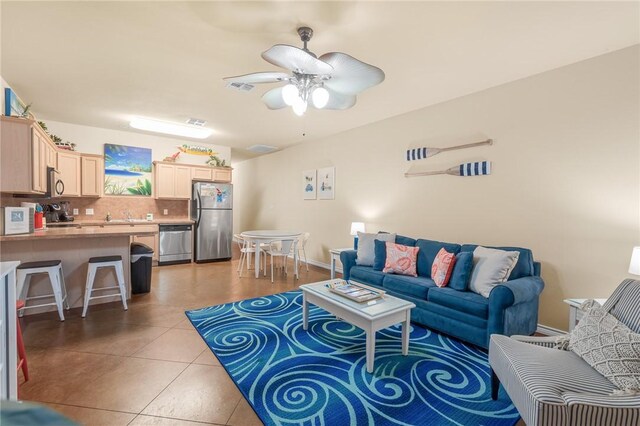 15209 S Padre Island Dr Unit 304, Corpus Christi, TX 78418 - living area featuring a ceiling fan, light tile patterned floors, and baseboards