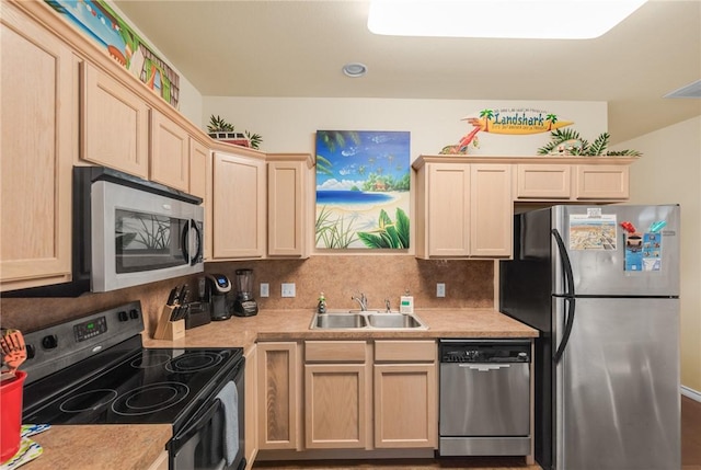 15209 S Padre Island Dr Unit 304, Corpus Christi, TX 78418 - kitchen featuring appliances with stainless steel finishes, a sink, light brown cabinets, light countertops, and tasteful backsplash