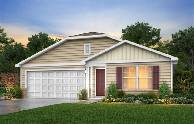 view of front facade with a garage and a yard