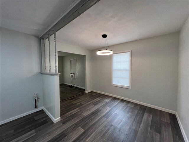 unfurnished dining area with dark wood-type flooring