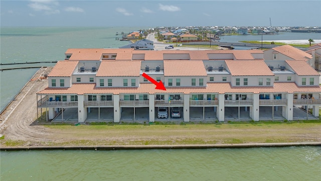 birds eye view of property featuring a water view