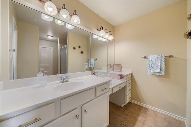 bathroom featuring tile patterned floors, vanity, and a shower with door